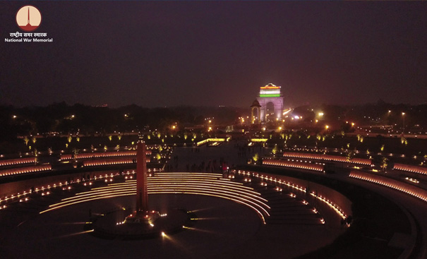 National War Memorial with India Gate in backdrop by night